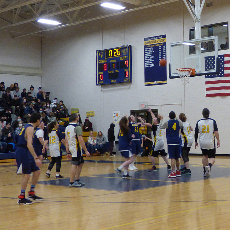 Featured image of article: All-School Assembly Features Unified vs Faculty Basketball Game
