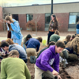 Featured image of article: Student Leaders Plant Yellow Tulip Garden