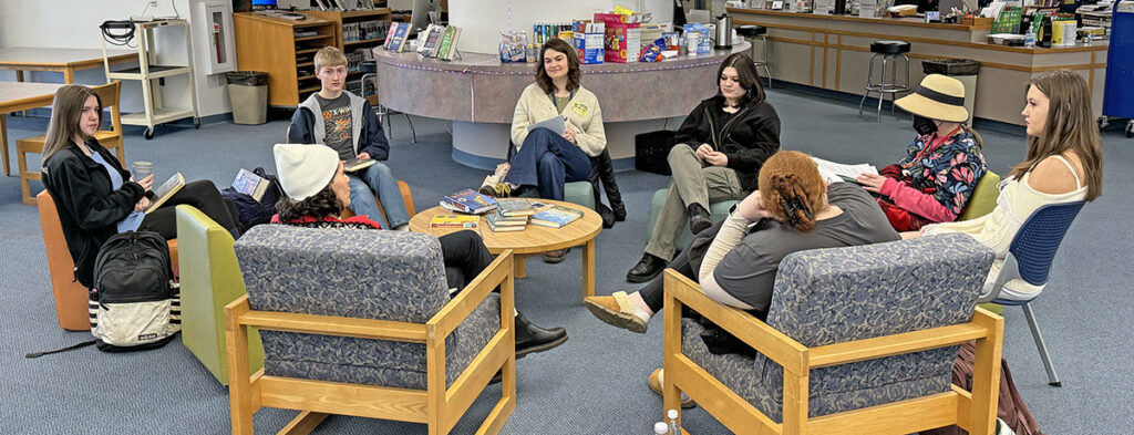 Featured image of article: Book Club Meets To Discuss “The Stranger In The Woods”